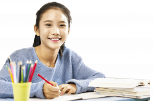 Secondary school girl smiling and studying